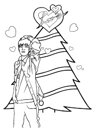 Justin Bieber stands next to a Christmas tree. Coloring Page